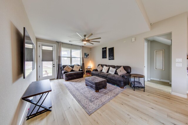 living room featuring ceiling fan and light wood-type flooring