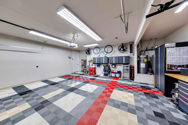 garage with a garage door opener and water heater