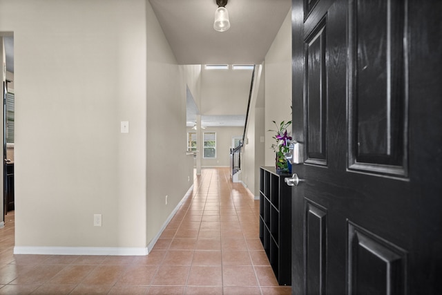 corridor featuring light tile patterned floors