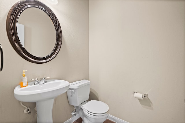 bathroom featuring sink and toilet