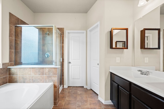 bathroom with vanity and separate shower and tub