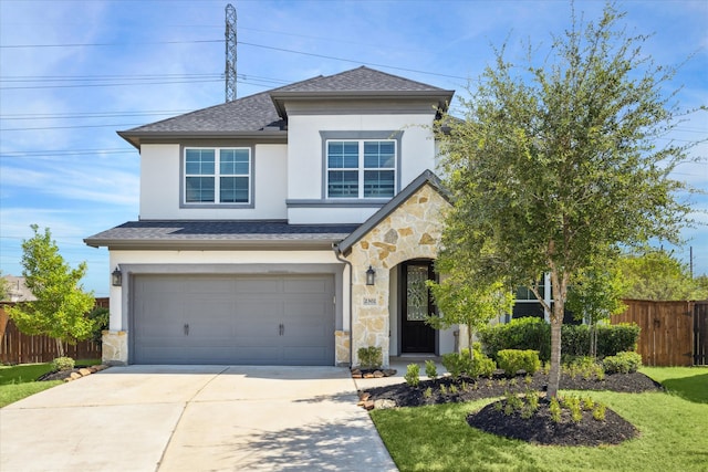 view of front facade featuring a garage and a front yard