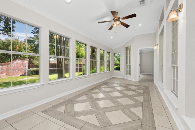 unfurnished sunroom with ceiling fan, lofted ceiling, and a healthy amount of sunlight