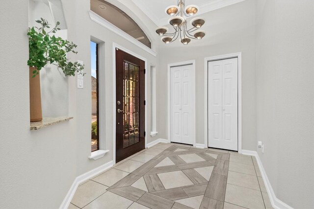 tiled foyer entrance featuring vaulted ceiling and a notable chandelier