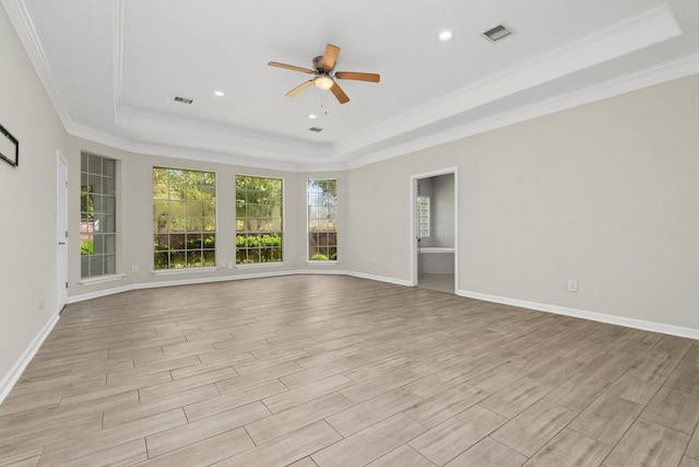 82 Champion Villa Dr, Houston, TX 77069 - unfurnished room featuring visible vents, light wood-type flooring, crown molding, and a tray ceiling