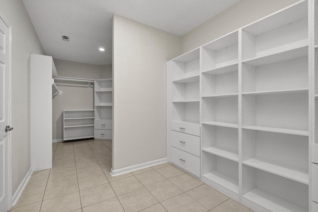 spacious closet featuring light tile patterned flooring