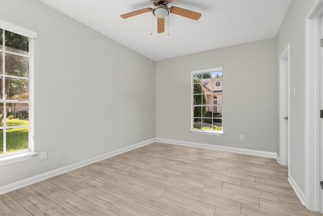 82 Champion Villa Dr, Houston, TX 77069 - spare room featuring light wood-type flooring, a ceiling fan, and baseboards