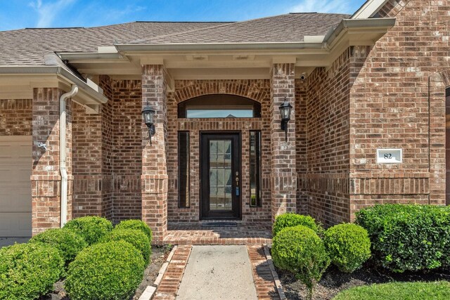 entrance to property featuring a garage