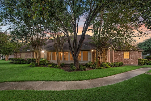 view of front of home with a lawn