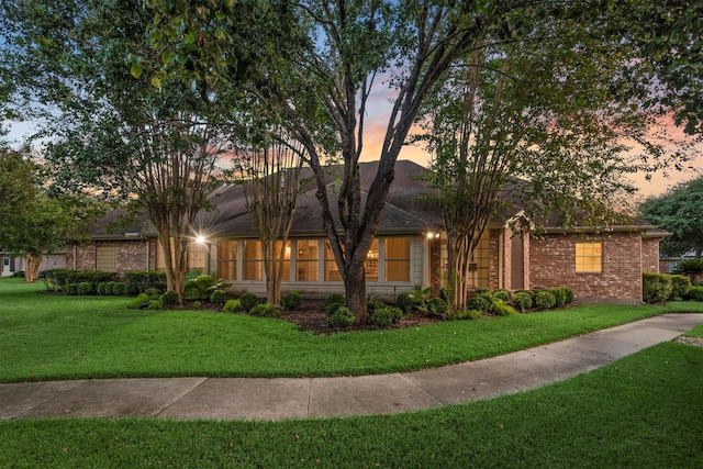 82 Champion Villa Dr, Houston, TX 77069 - view of front of home featuring a front yard and brick siding