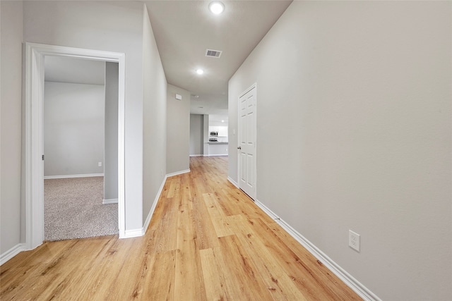 corridor featuring light hardwood / wood-style flooring