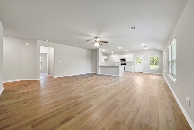 unfurnished living room with light hardwood / wood-style floors, lofted ceiling, and ceiling fan