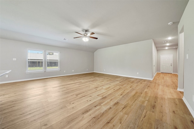 empty room featuring ceiling fan and light hardwood / wood-style flooring