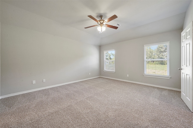 carpeted empty room featuring ceiling fan