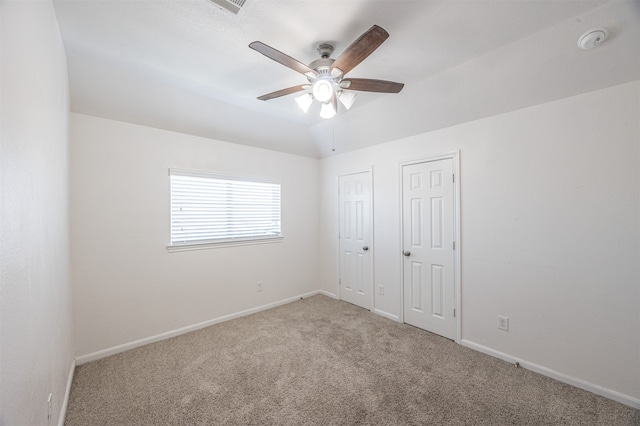 unfurnished bedroom featuring ceiling fan and carpet floors