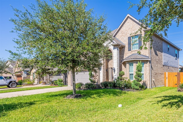 view of front of home featuring a front lawn and a garage