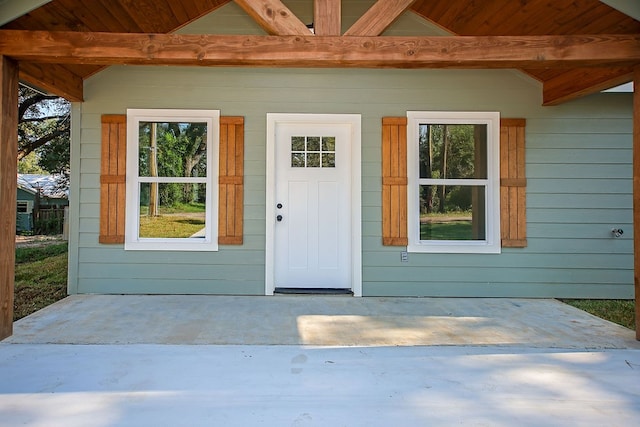 property entrance featuring a patio