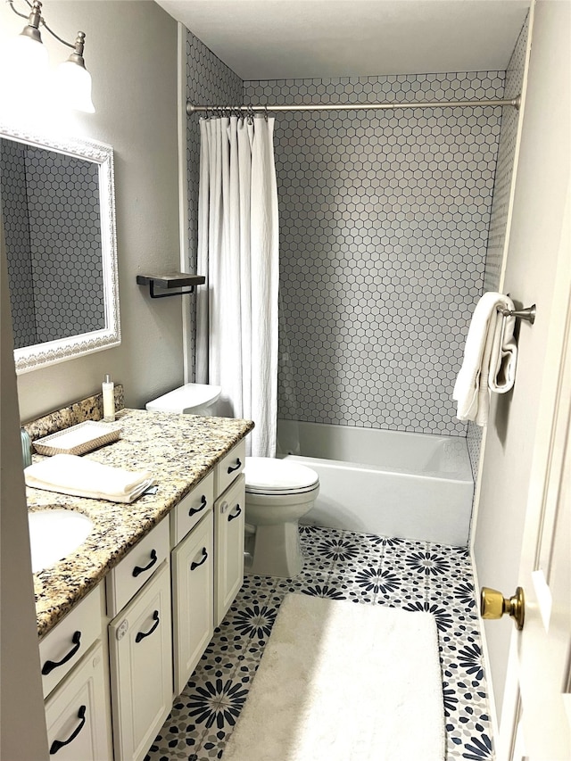 full bathroom featuring shower / bath combination with curtain, tile patterned floors, vanity, and toilet