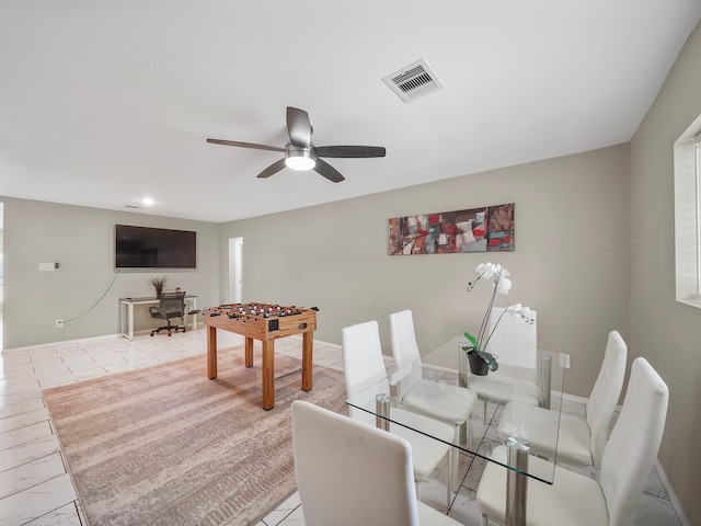 dining space with ceiling fan