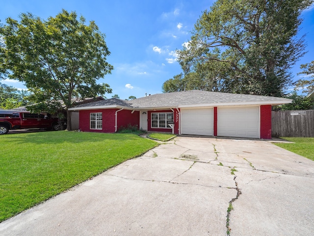 single story home with a front lawn and a garage