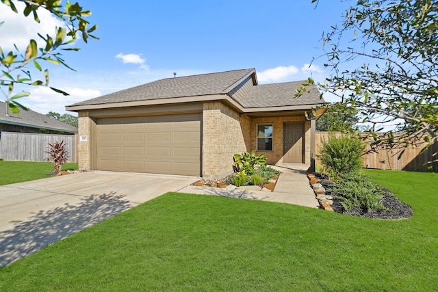 view of front of home with a front yard and a garage