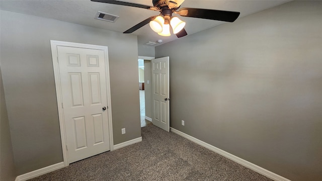 unfurnished bedroom with carpet and ceiling fan