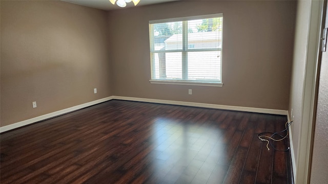 unfurnished room featuring dark hardwood / wood-style floors