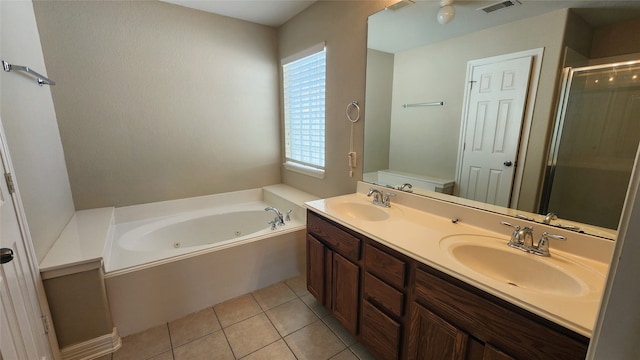 bathroom featuring vanity, plus walk in shower, and tile patterned floors