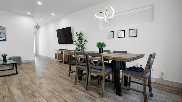 dining area with wood-type flooring