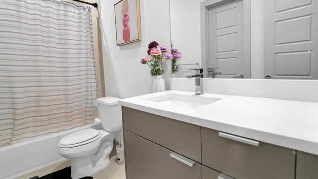 full bathroom with shower / bathtub combination with curtain, vanity, and toilet