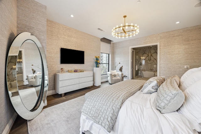 bedroom featuring dark hardwood / wood-style flooring and a chandelier