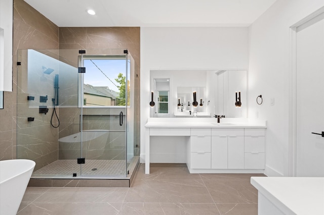 bathroom with independent shower and bath and vanity