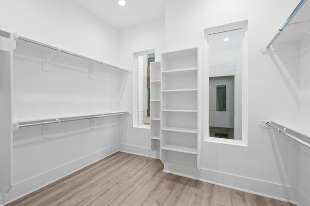 walk in closet featuring light hardwood / wood-style floors