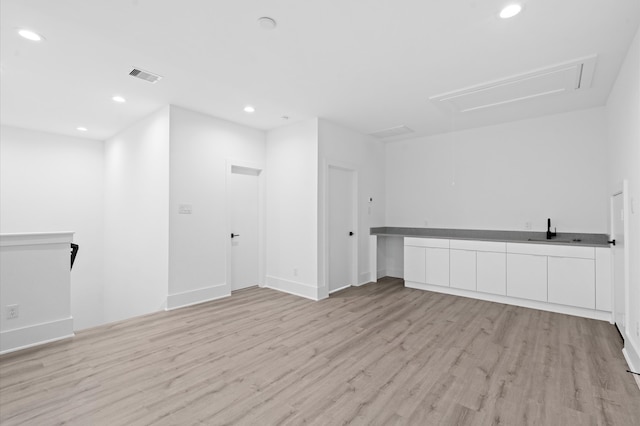 interior space featuring light hardwood / wood-style floors and sink