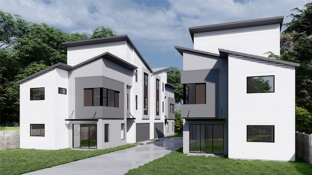 view of front facade with a front yard and a garage