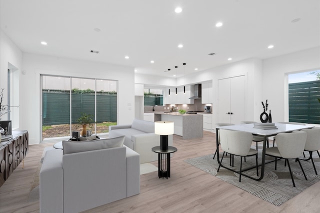 living room with light hardwood / wood-style floors