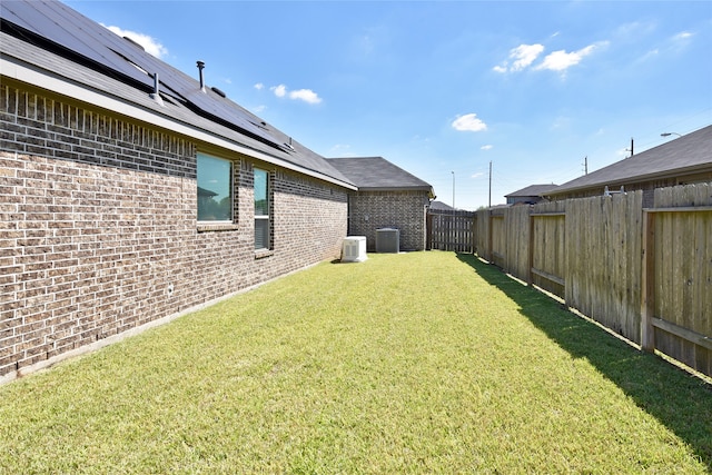 view of yard featuring central air condition unit