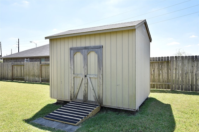 view of outdoor structure with a yard