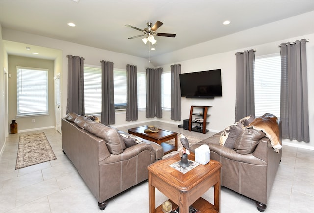 living room featuring ceiling fan and light tile patterned flooring