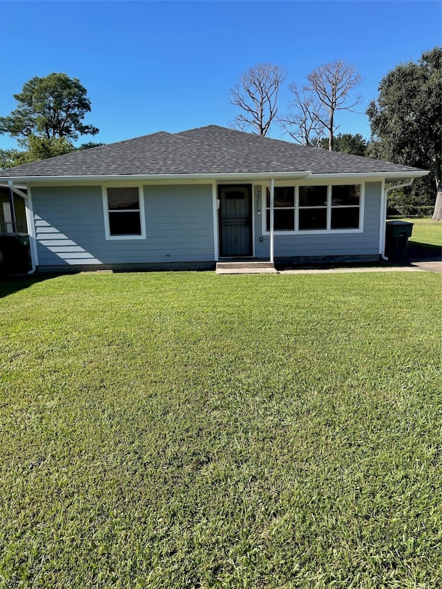 ranch-style home featuring a front yard