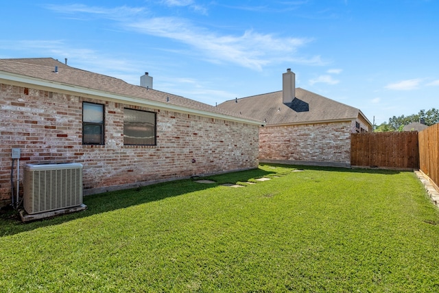 view of yard with central AC