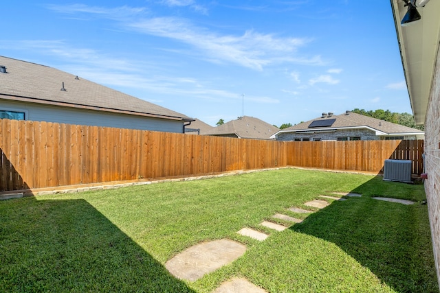 view of yard featuring central AC unit