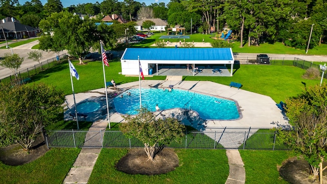 view of pool with a yard and a patio