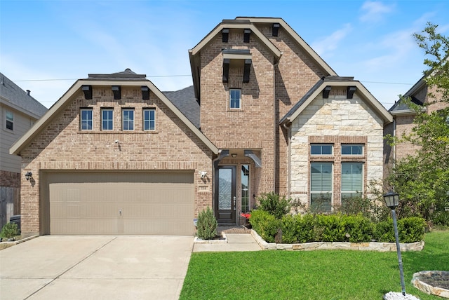 view of front of home with a garage and a front lawn