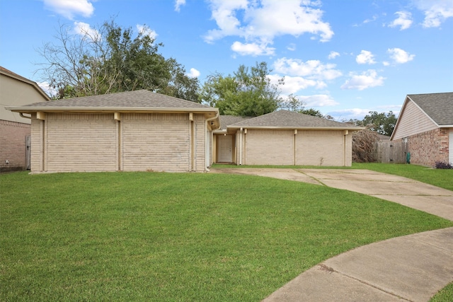 ranch-style home with a front yard and a garage