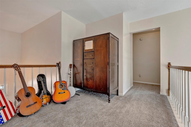 interior space featuring light carpet