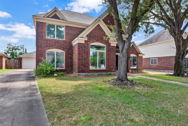 view of front of house featuring a front yard and a garage