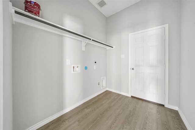 laundry area featuring washer hookup, hookup for an electric dryer, and light wood-type flooring