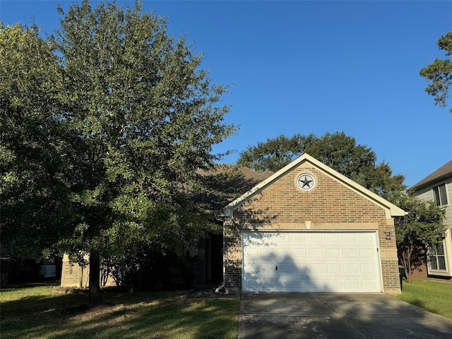 view of front facade with a front yard and a garage