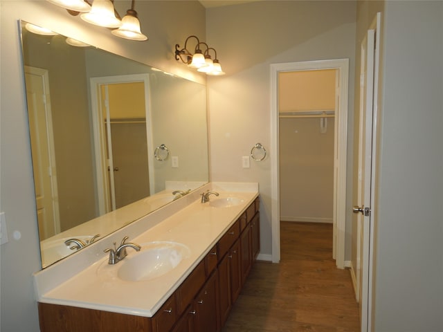 bathroom with vanity and hardwood / wood-style floors